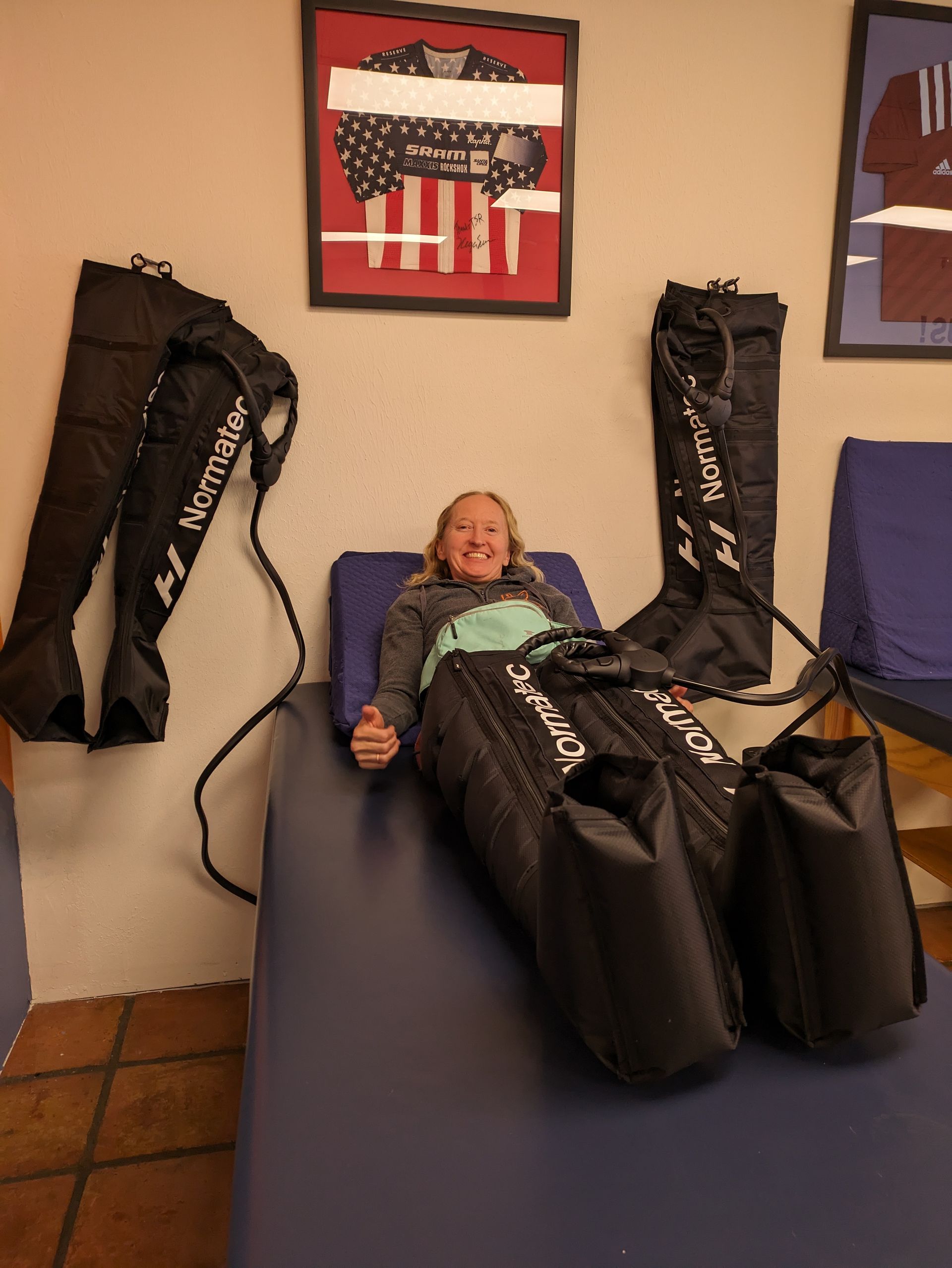 a woman with normatec compression boots on