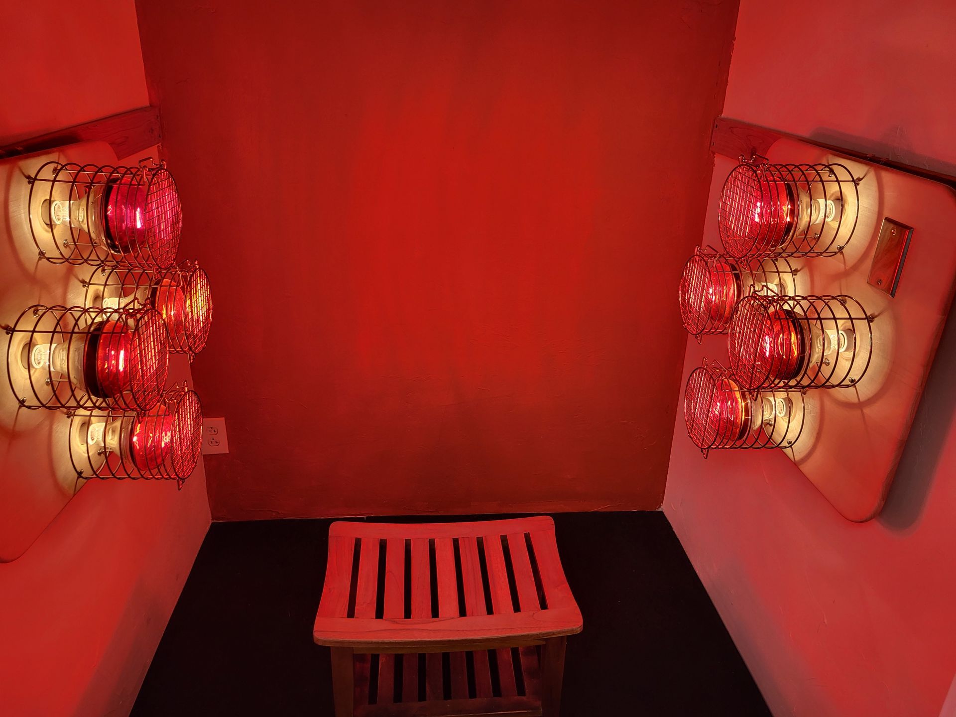 Near infrared sauna with a wooden stool in the middle