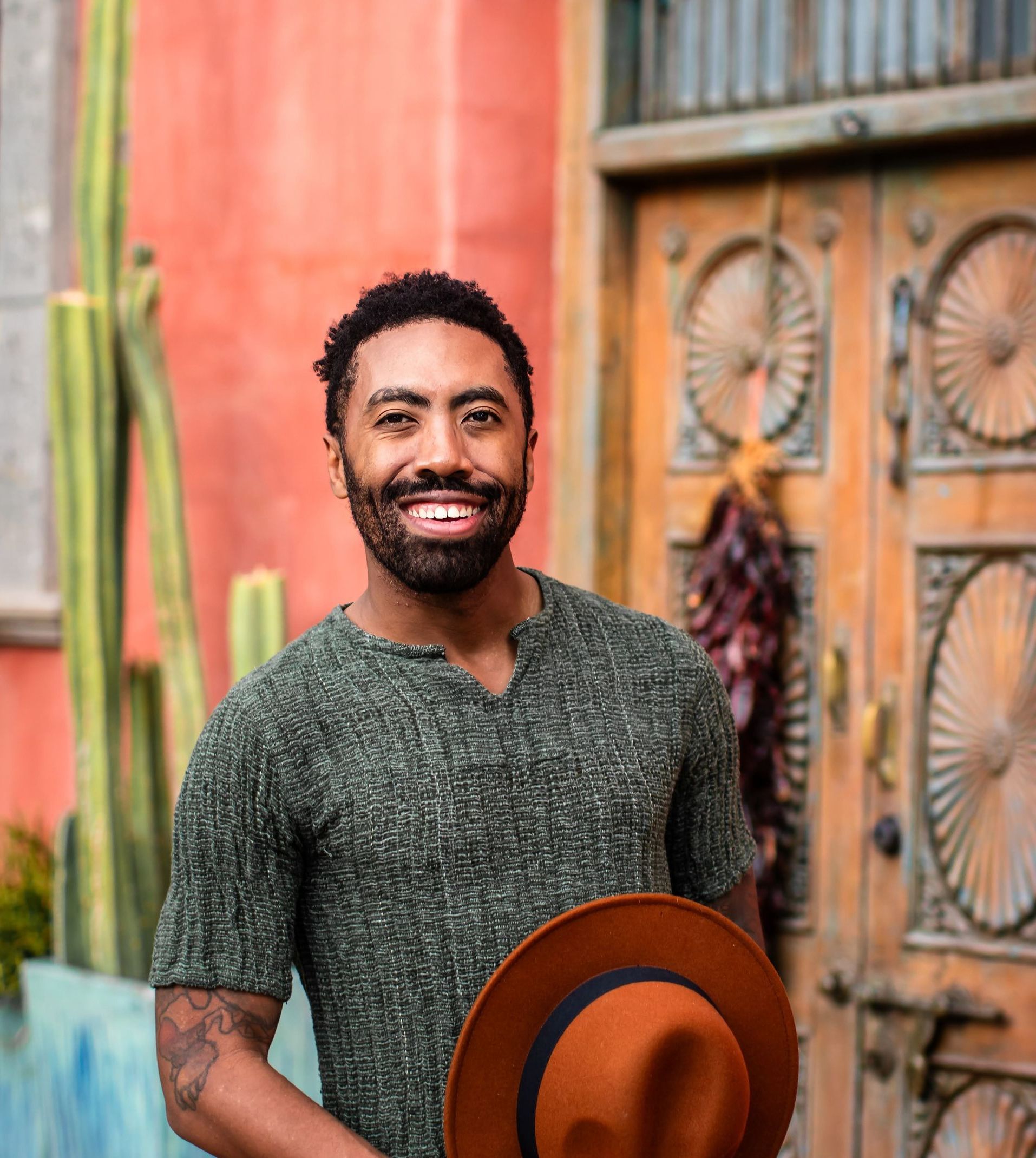 a massage therapist looking into the camera and smiling