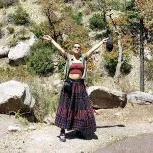 a massage therapist looking into the camera and smiling