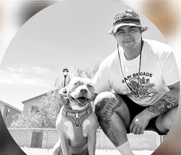 a massage therapist looking into the camera and smiling