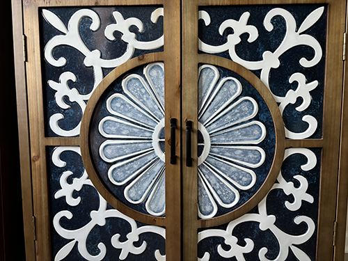 Pilates and Intuitive Energy Healing. wooden door with a stained glass design on it.