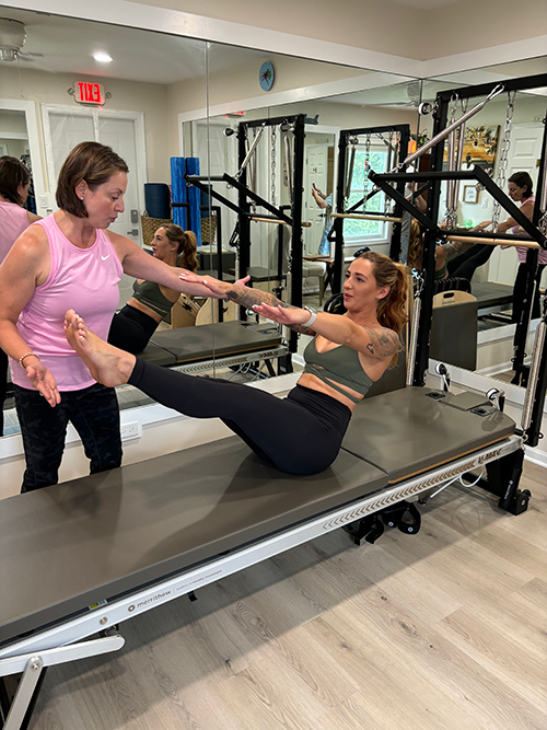 Pilates and Intuitive Energy Healing. Asha pilates with client.
