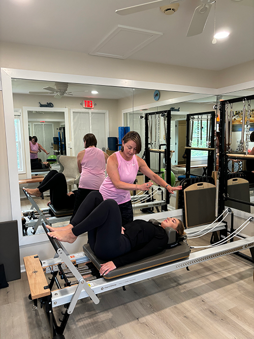 Pilates and Intuitive Energy Healing. Ahsa pilates machine in a gym.