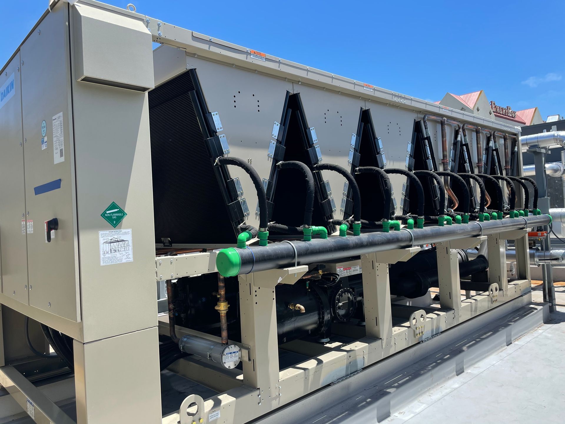 A large machine is sitting on top of a building.