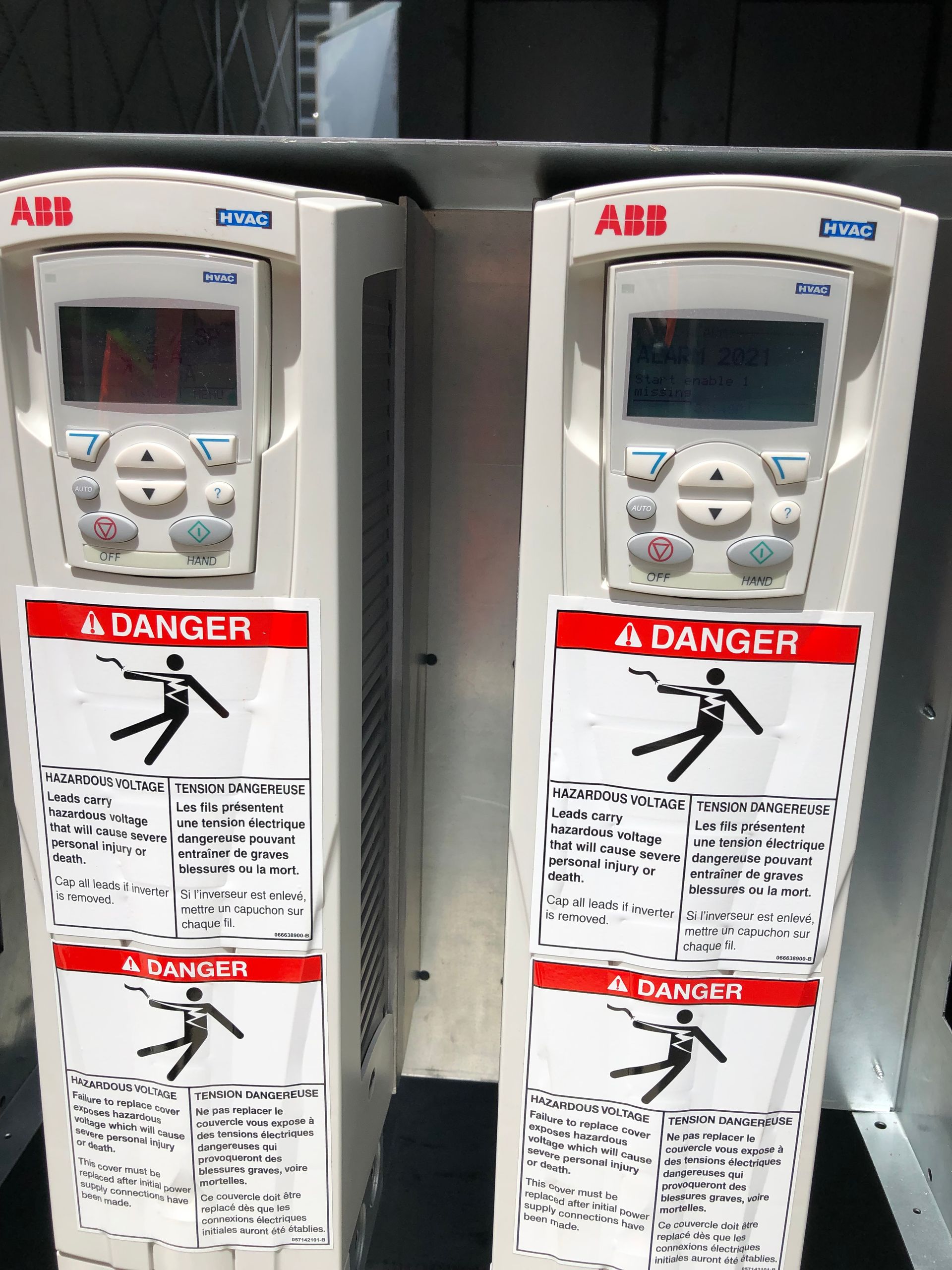 Two abb drives are sitting next to each other on a shelf.