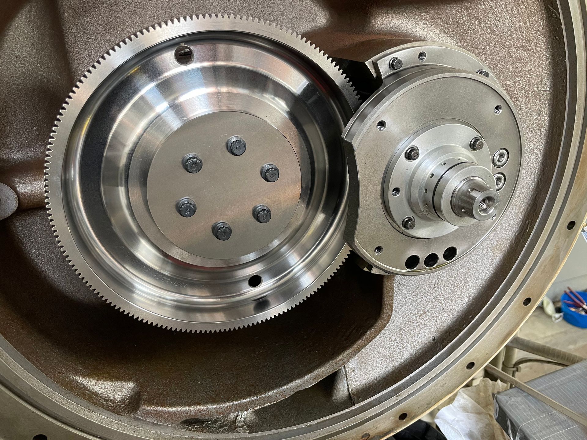 A close up of a metal gear on a machine.