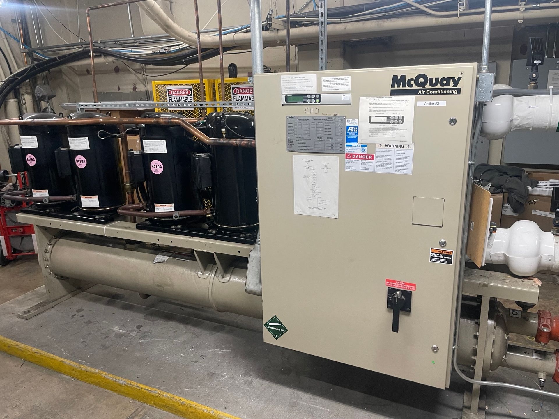 A large mcquay machine is sitting in a room.