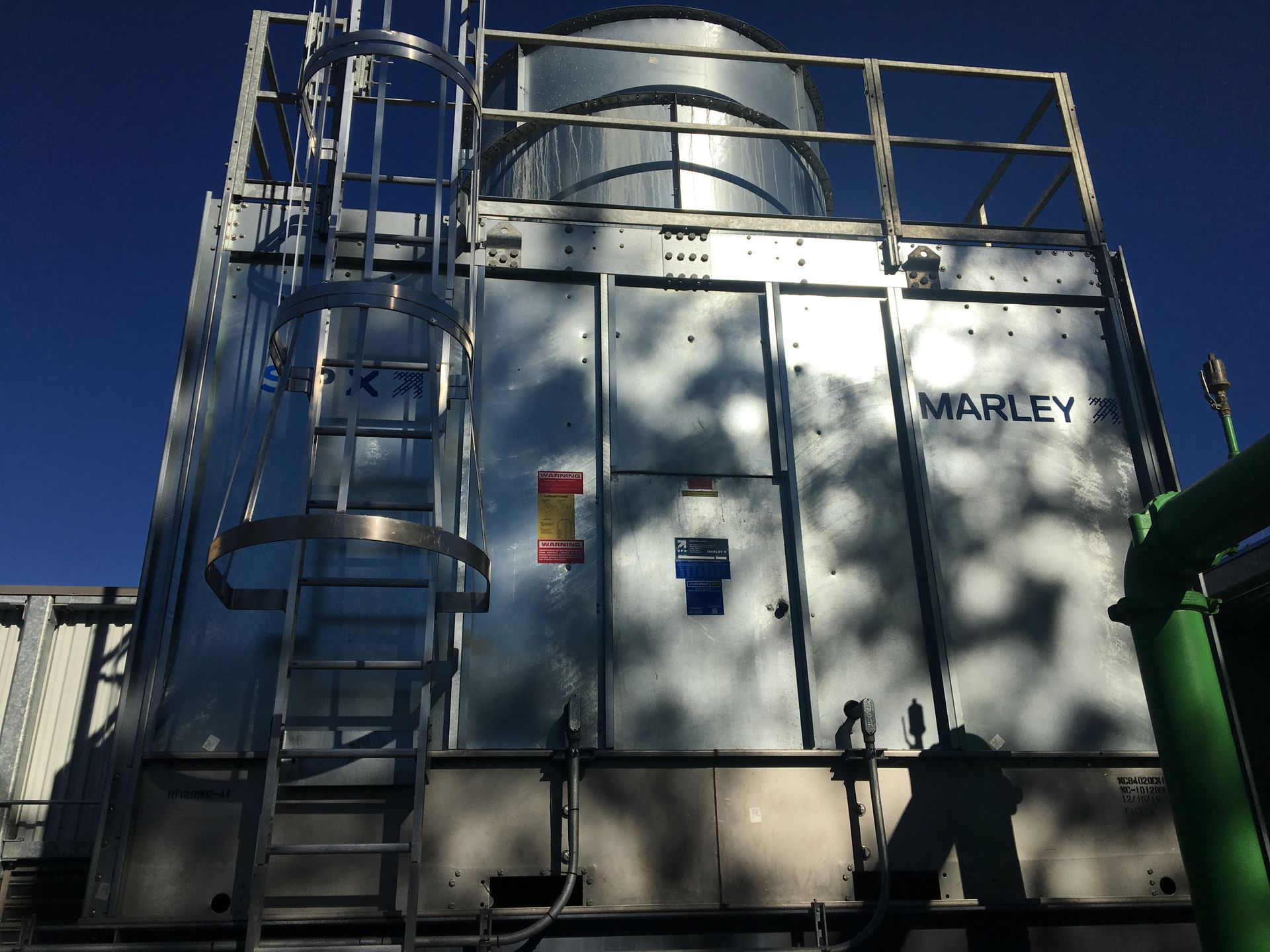 A large metal building with the word marley on it