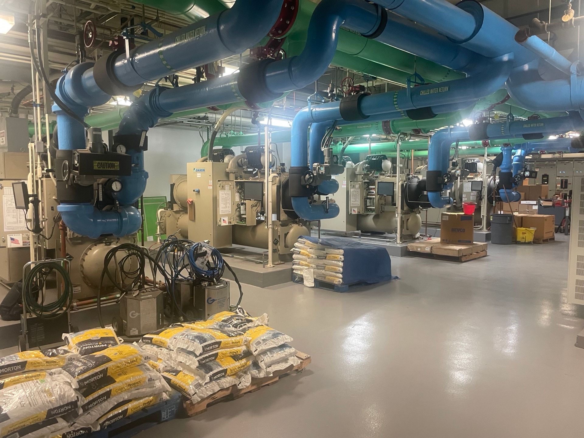 A large room filled with lots of pipes and pumps.