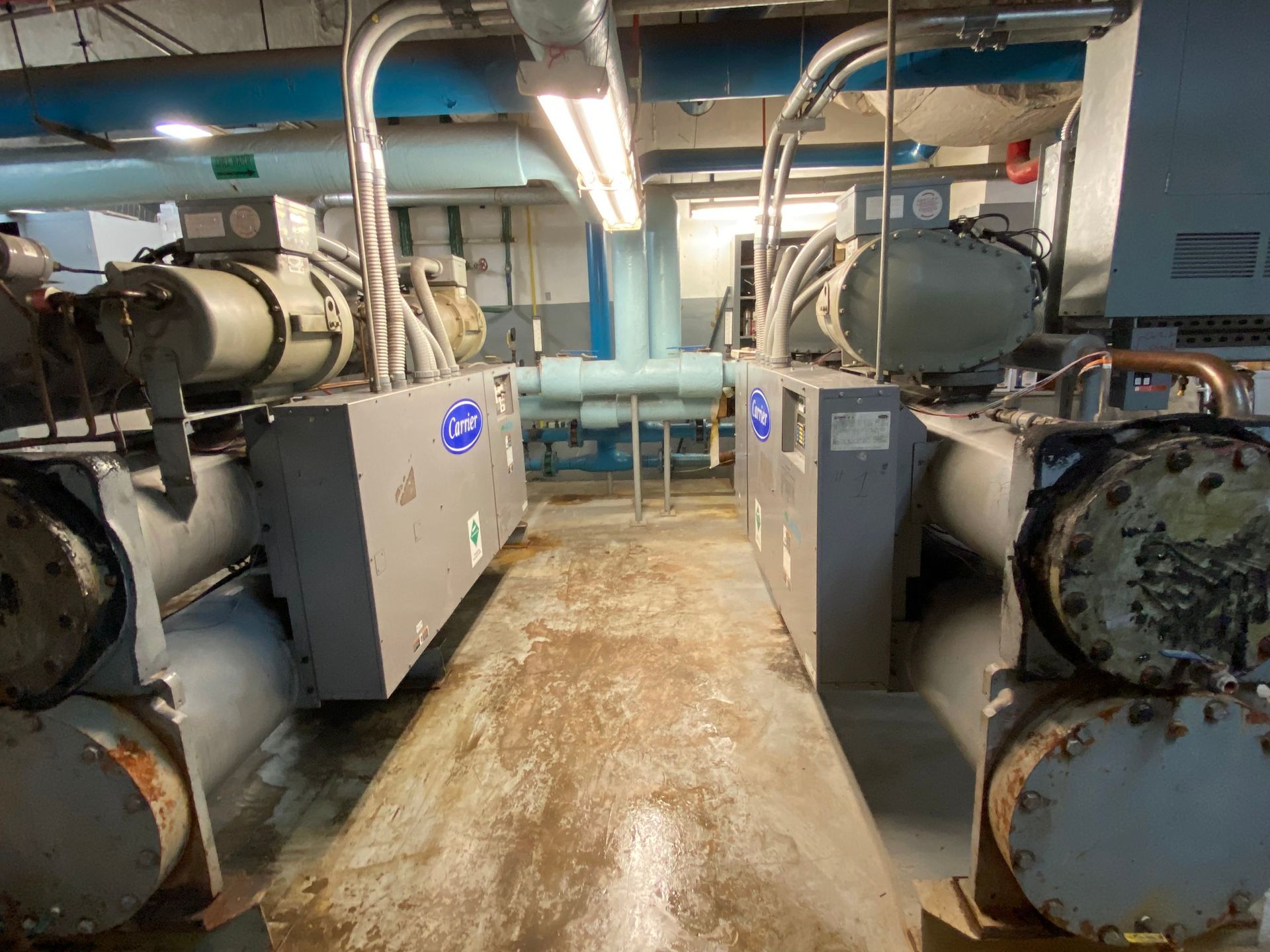 A room with a lot of pipes and machinery in it