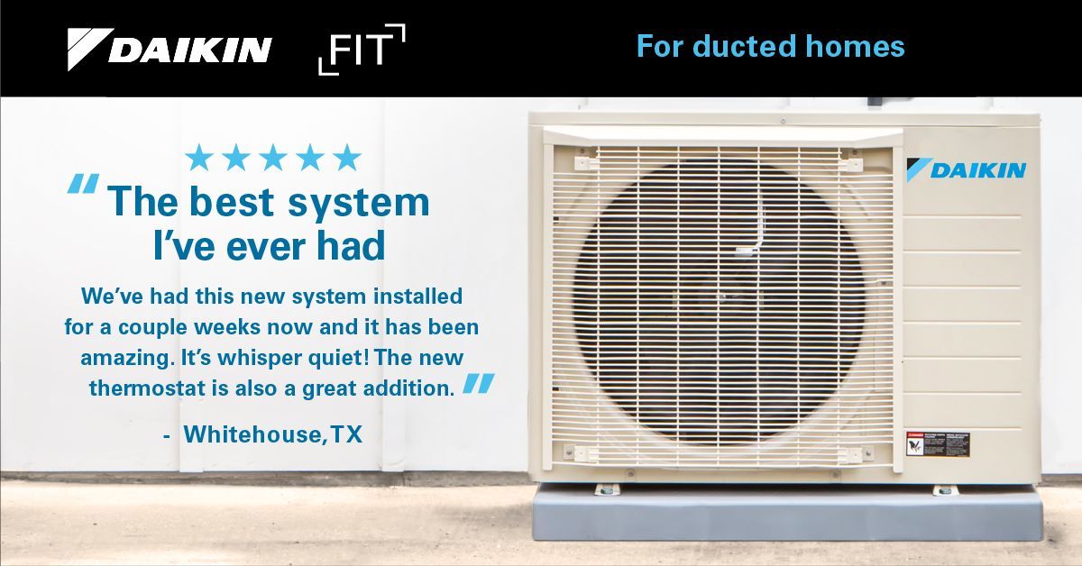 A daikin air conditioner is sitting on the side of a building.