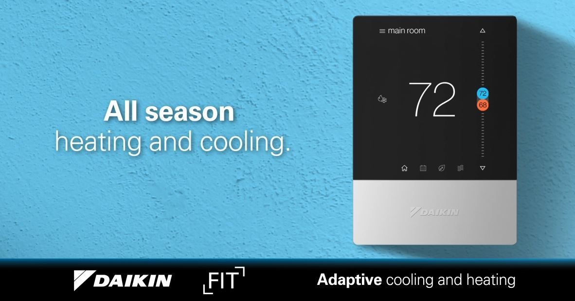 A daikin thermostat is sitting on a blue wall.
