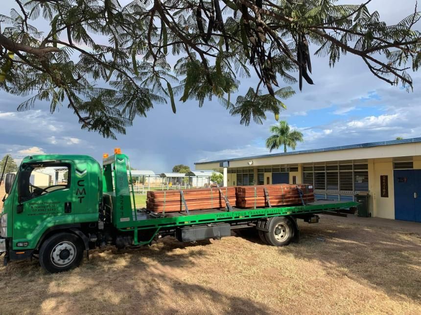 A Green Tow Truck Is Parked in Front of A Building — Coalfields Mechanical & Towing in Blackwater, QLD