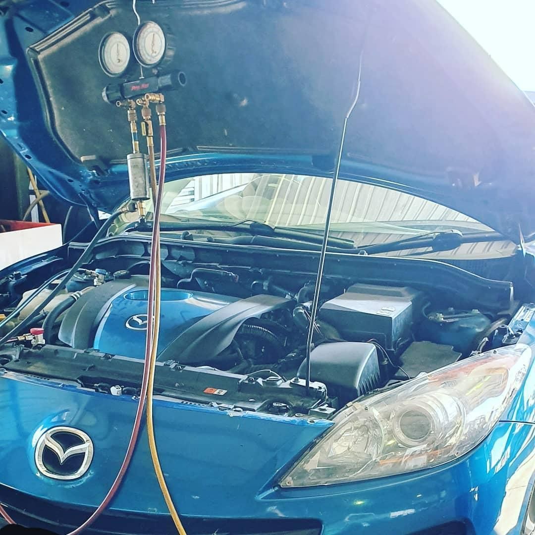A Blue Car with The Hood Open Is Being Serviced — Coalfields Mechanical & Towing in Blackwater, QLD