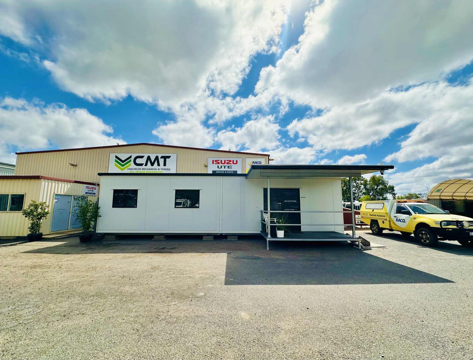 A Room with A Green Wall and A Sign that Says CMT — Coalfields Mechanical & Towing in Blackwater, QLD