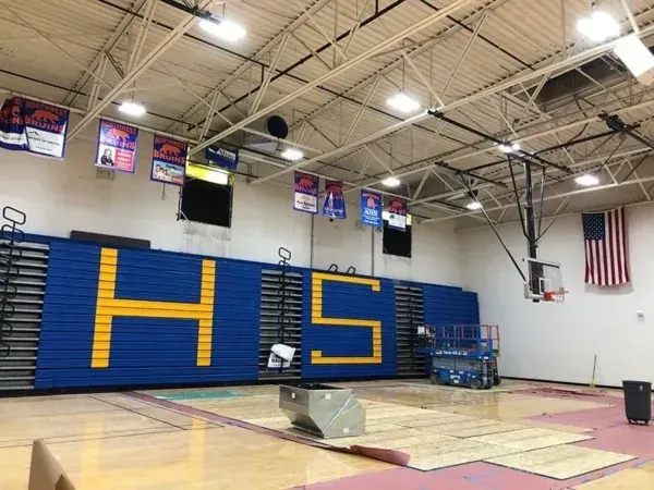 Gymnasium interior with blue and gold