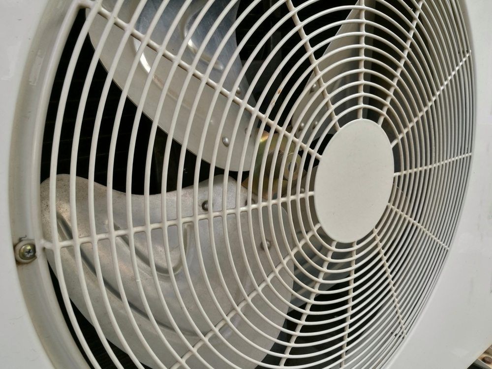 A Close Up of a White Fan on a Wall — Todd Hayes Refrigeration & Air Conditioning Pty Ltd in Kyogle, NSW