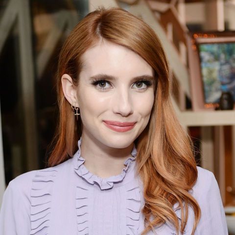 woman smiling with long red hair