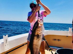 Fishing Destin, FL | Destin Harbor | Charter Boat Relentless | www.charterboatrelentless.com | A Luxury Charter Boat at Everyday Rates | 65' x 20' | Strong Girl with a Strong Amberjack!