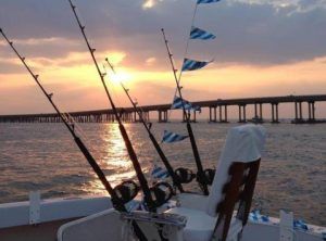 Fishing Destin, FL | Destin Harbor | Charter Boat Relentless | www.charterboatrelentless.com | A Luxury Charter Boat at Everyday Rates | 65' x 20' | Cockpit, Sunset Destin Harbor | Destin Bridge