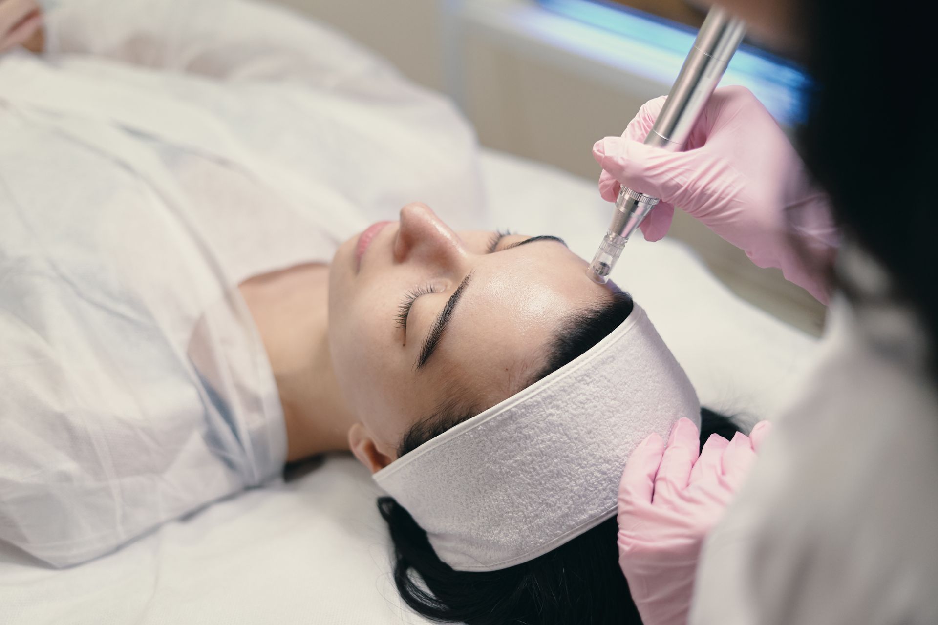 Microneedling facial rejuvenation treatment