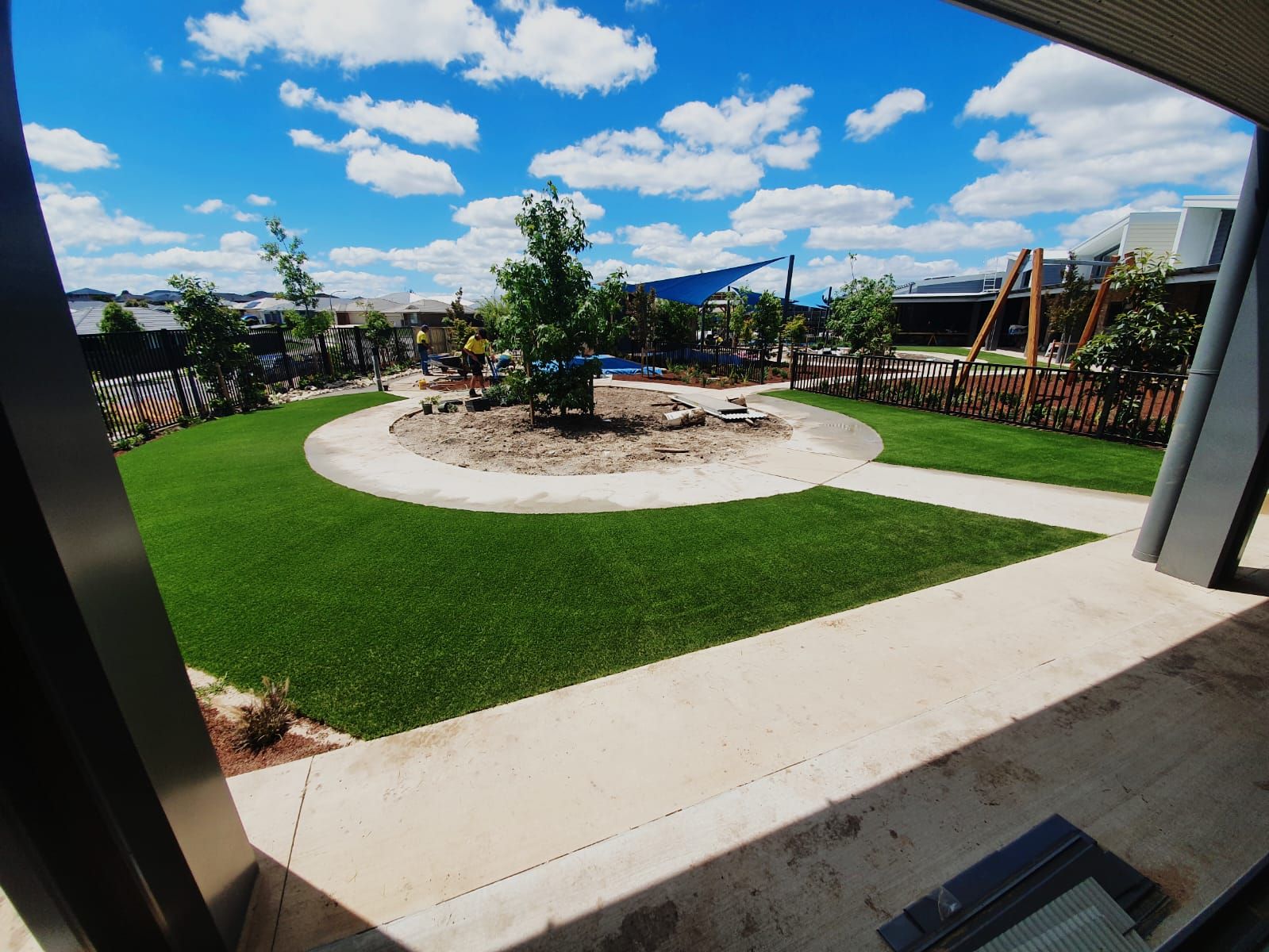 A view of a park from a window on a sunny day