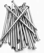 A pile of stainless steel nails on a white background.