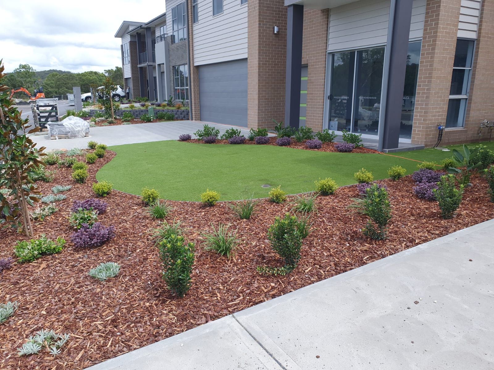 A large house with a lush green lawn in front of it.