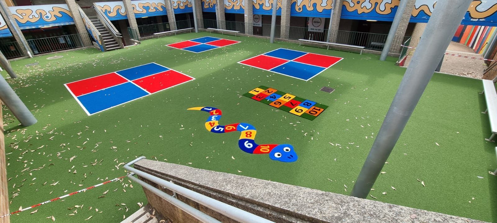 A playground with a lot of colorful toys on it.