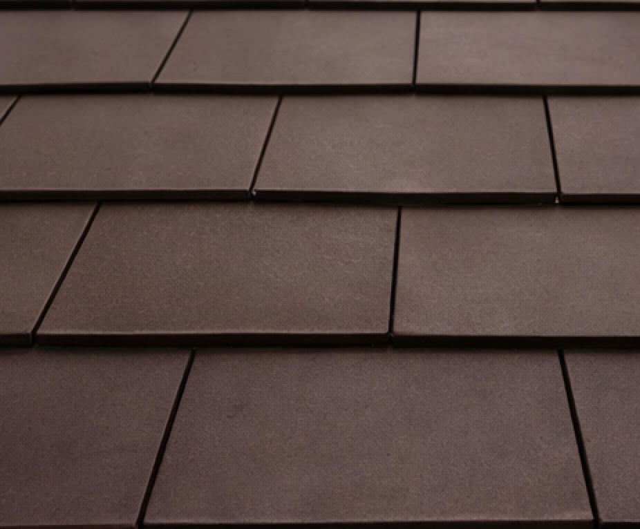 Brown rectangular roof tiles arranged in overlapping rows.
