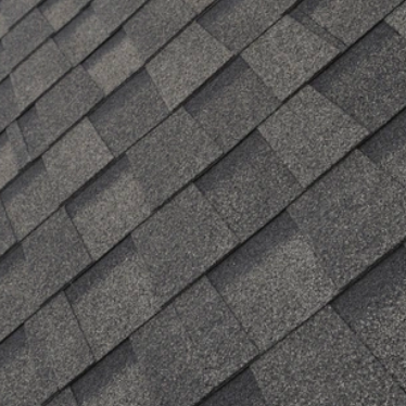 Dark gray asphalt roof shingles.