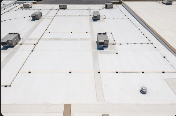 White commercial flat roof with HVAC units.