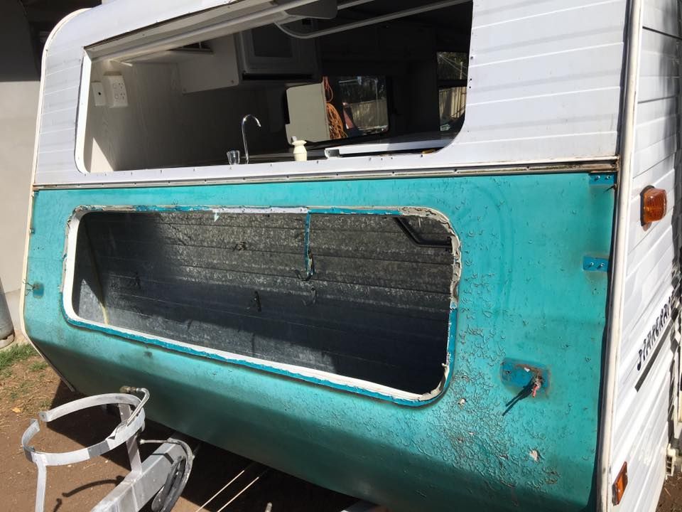 Teal and White Camper Exterior With an Open Front Window — Andy's Caravan Repairs in Harristown, QLD