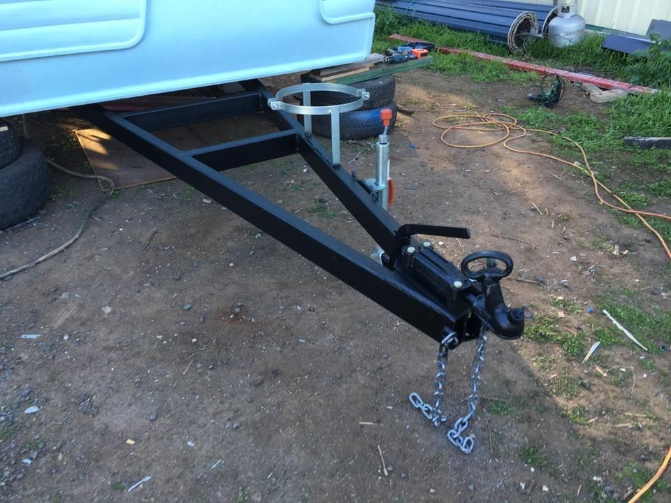Black Trailer Hitch With a White Camper — Andy's Caravan Repairs in Harristown, QLD