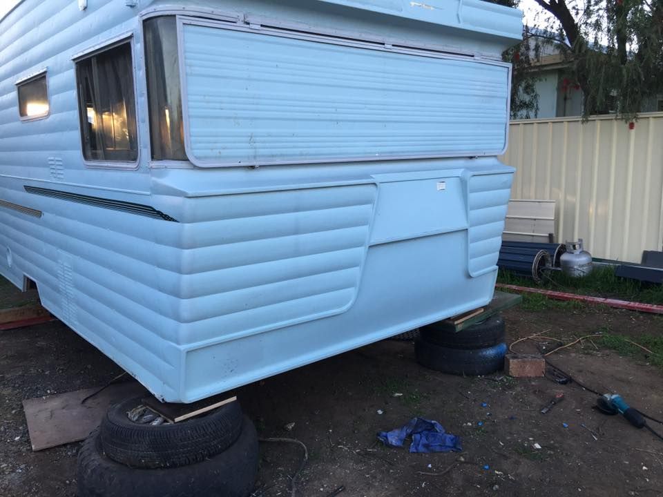 Light Blue Camper on Tires — Andy's Caravan Repairs in Harristown QLD