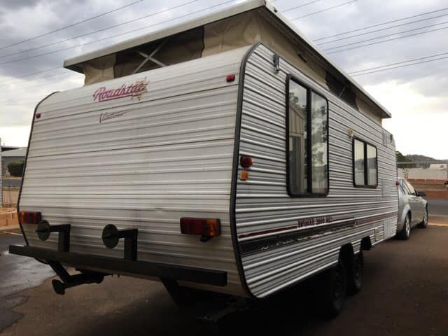 White Camper Trailer With Pop-up Roof, Parked on a Road — Andy's Caravan Repairs in Harristown, QLD