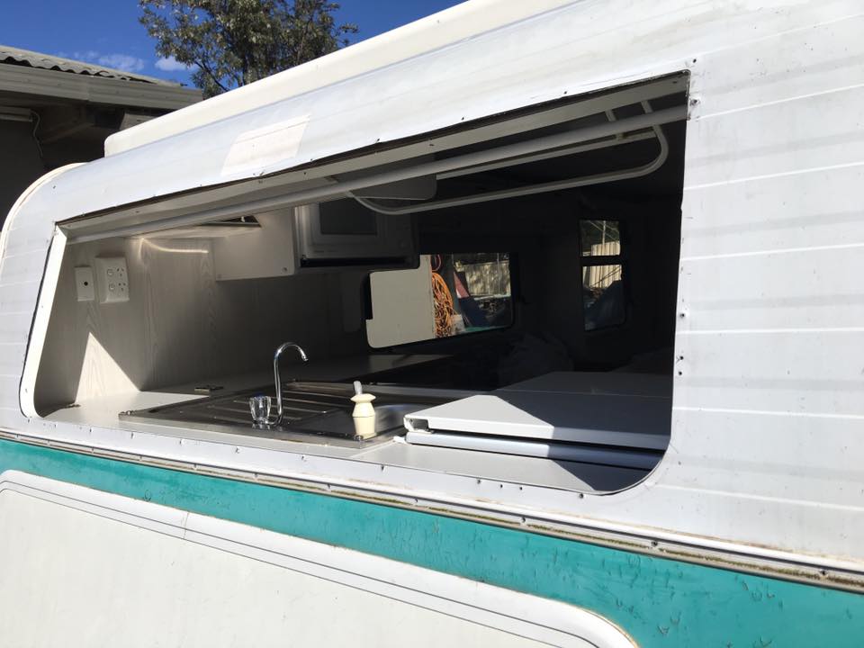 White and Turquoise Camper Van Showing the Interior — Andy's Caravan Repairs in Harristown, QLD