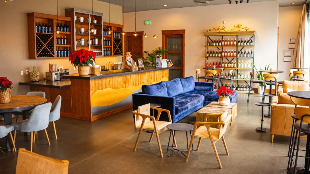 Two photos: outdoor patio with band, guests at tables, and indoor tasting room with guests seated.