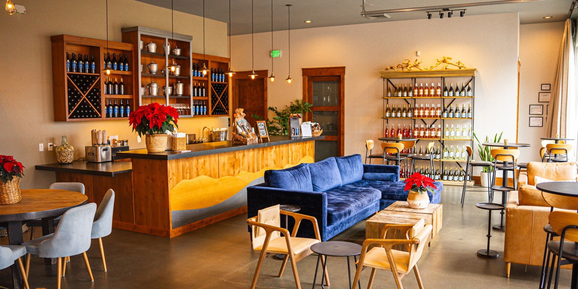 Cheese board and wine tasting with glass and vials on a speckled table.