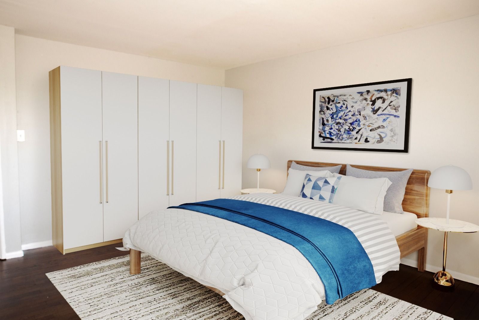 A bedroom with a large bed and a blue comforter