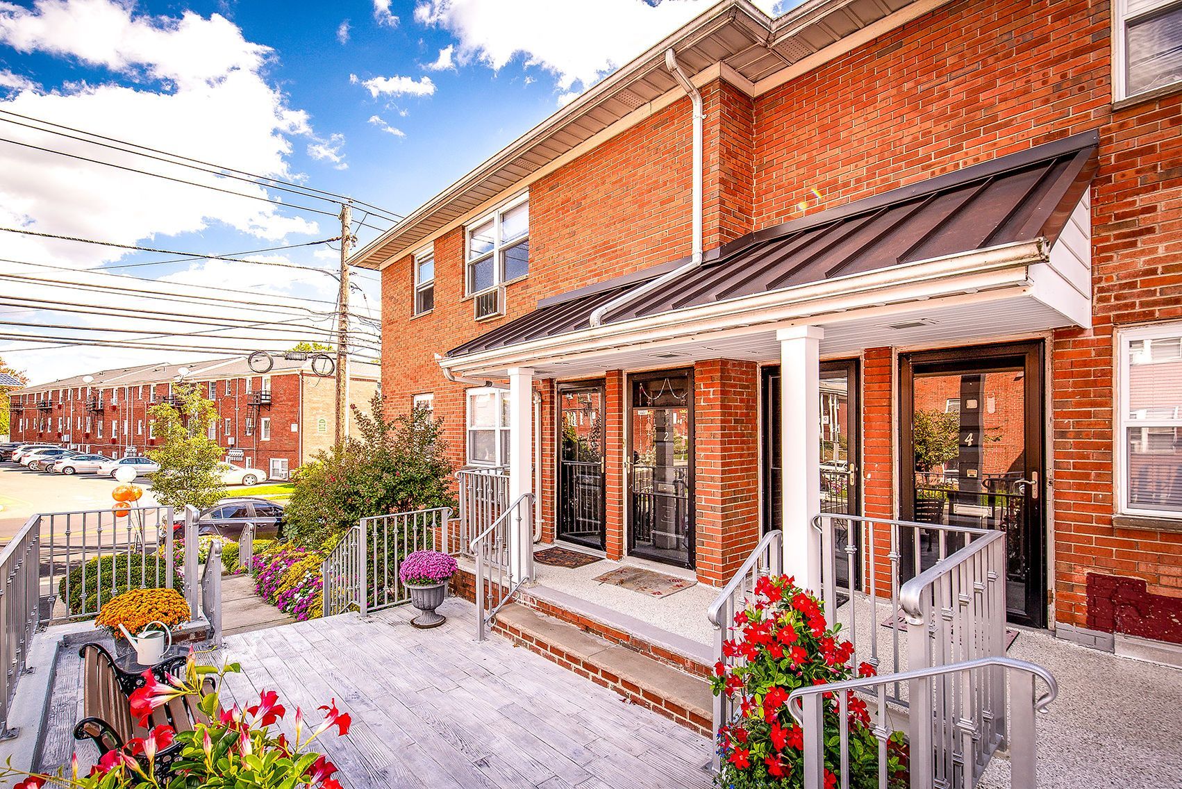 Brick apartment building exterior with a main entrance, steps, and railings. 
Ready to make Joralemon your home? Contact us today to learn more about our pet-friendly 1, 2, and 3-bedroom apartments for rent in Belleville, NJ. We can’t wait to welcome you home!