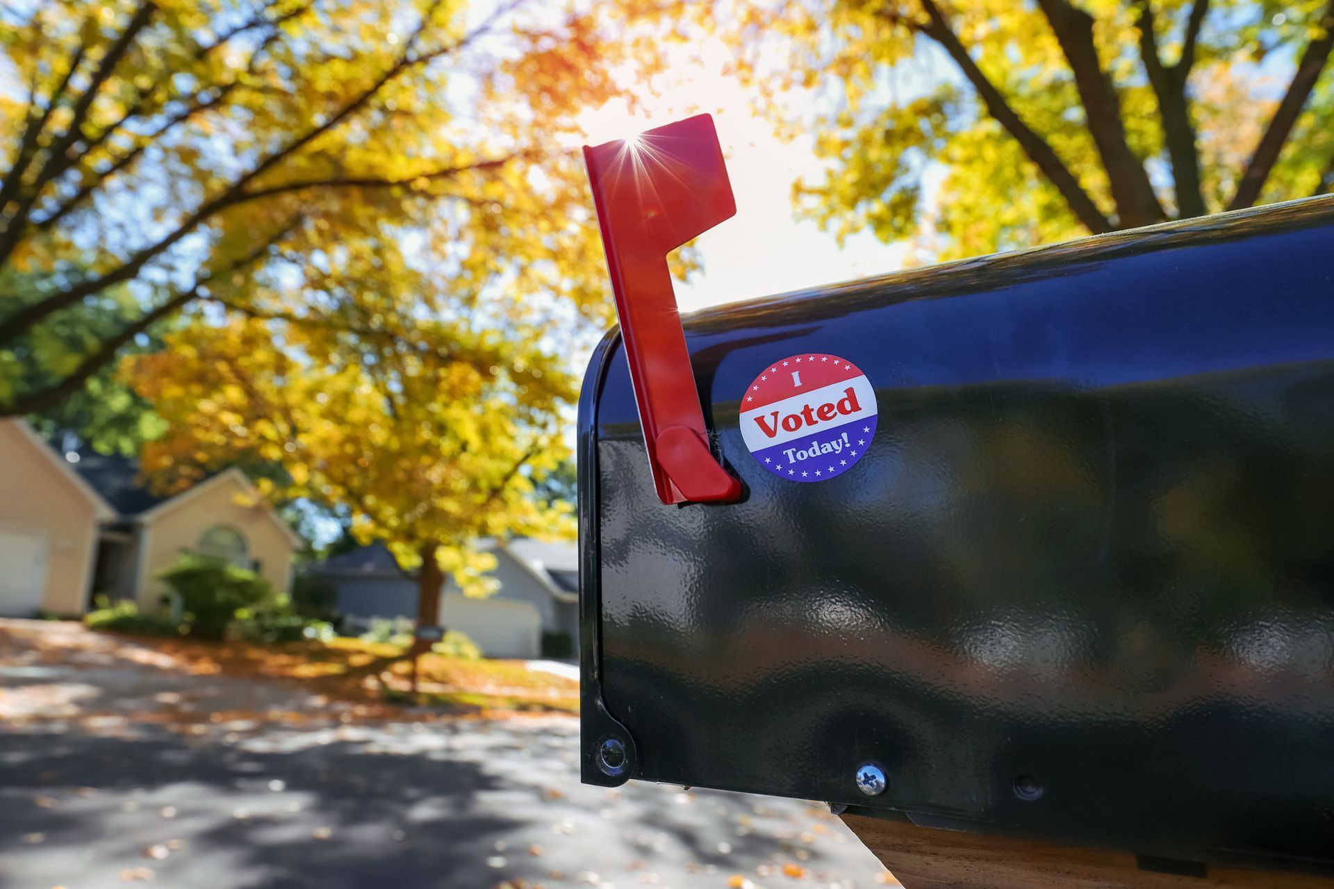 A mailbox with a sticker on it that says `` i voted ''.