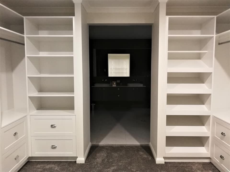 White Closet With Shelves and Drawers Flanking an Entryway — Payton Kitchens in Highfields, QLD