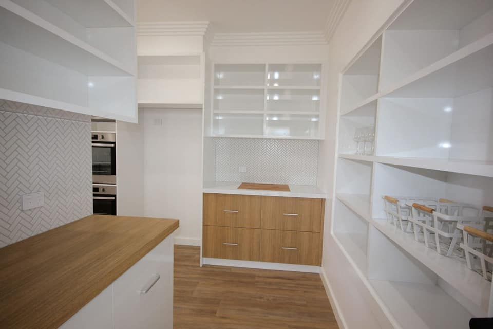 White and Wood-toned Pantry With Shelves and Cabinets  — Payton Kitchens In Wilsonton, QLD