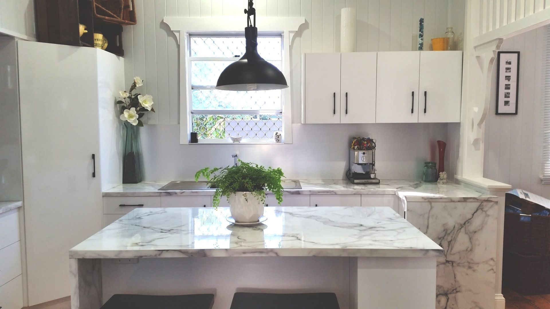 White Kitchen With Marble Countertops, Island With Potted Plant — Payton Kitchens In Wilsonton, QLD