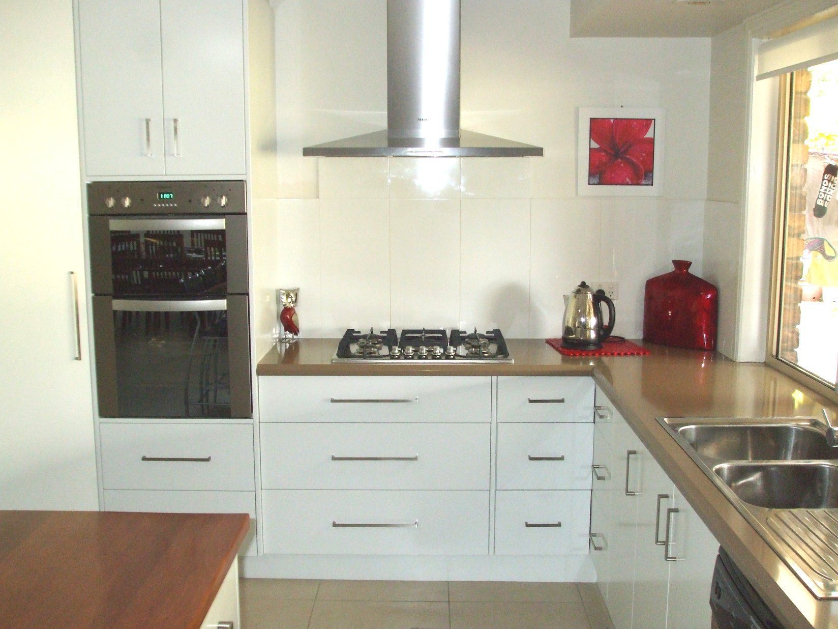 White Kitchen With Oven, Stovetop, and Sink — Payton Kitchens in Dalby, QLD