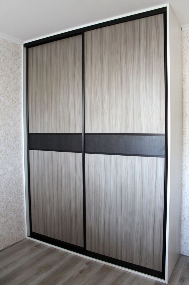 Sliding Door Closet, Light Wood Grain Panel, Black Horizontal Accent, White Frame — Payton Kitchens in Dalby, QLD