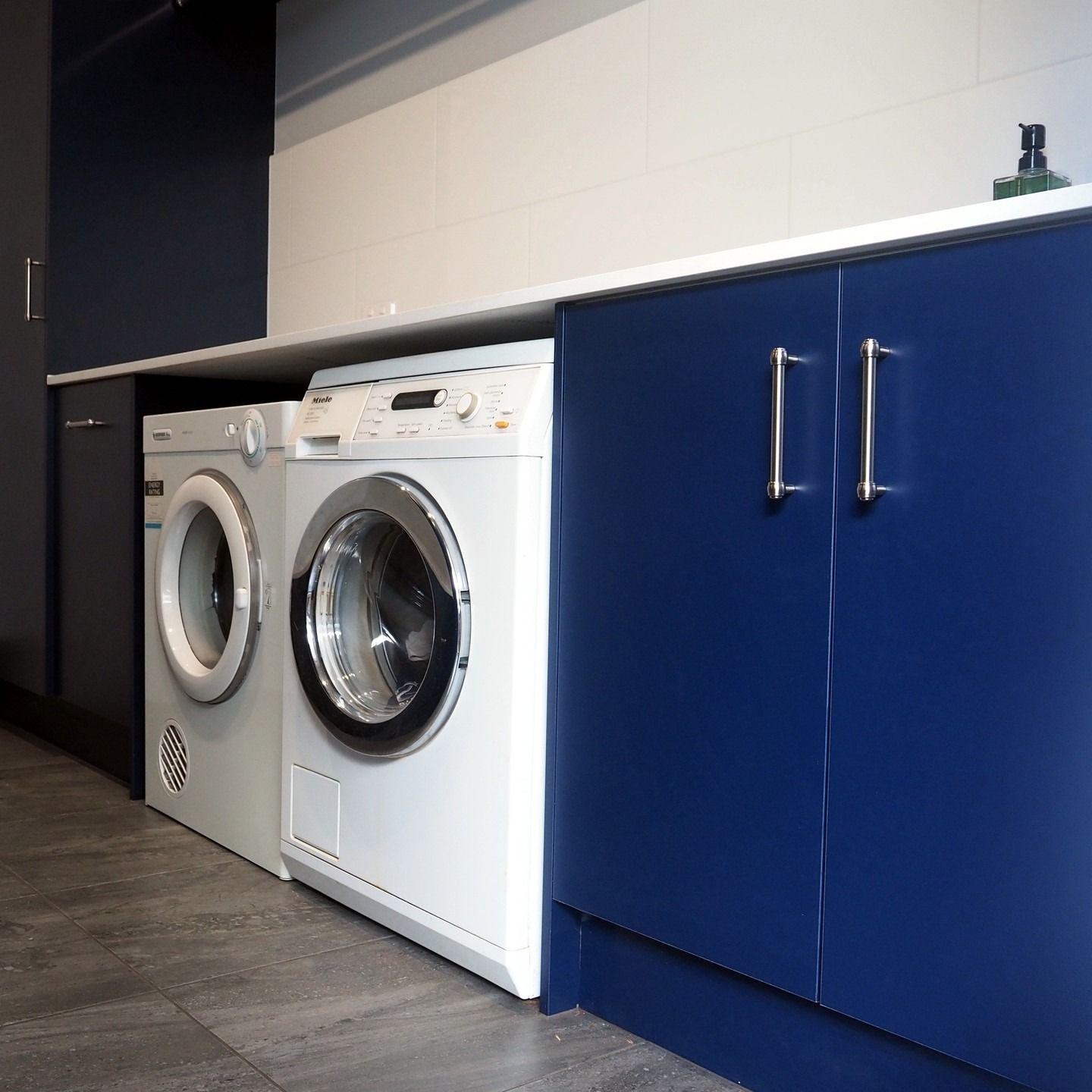 Laundry Room With Blue Cabinets, Washing Machine, and Dryer — Payton Kitchens in Gatton, QLD