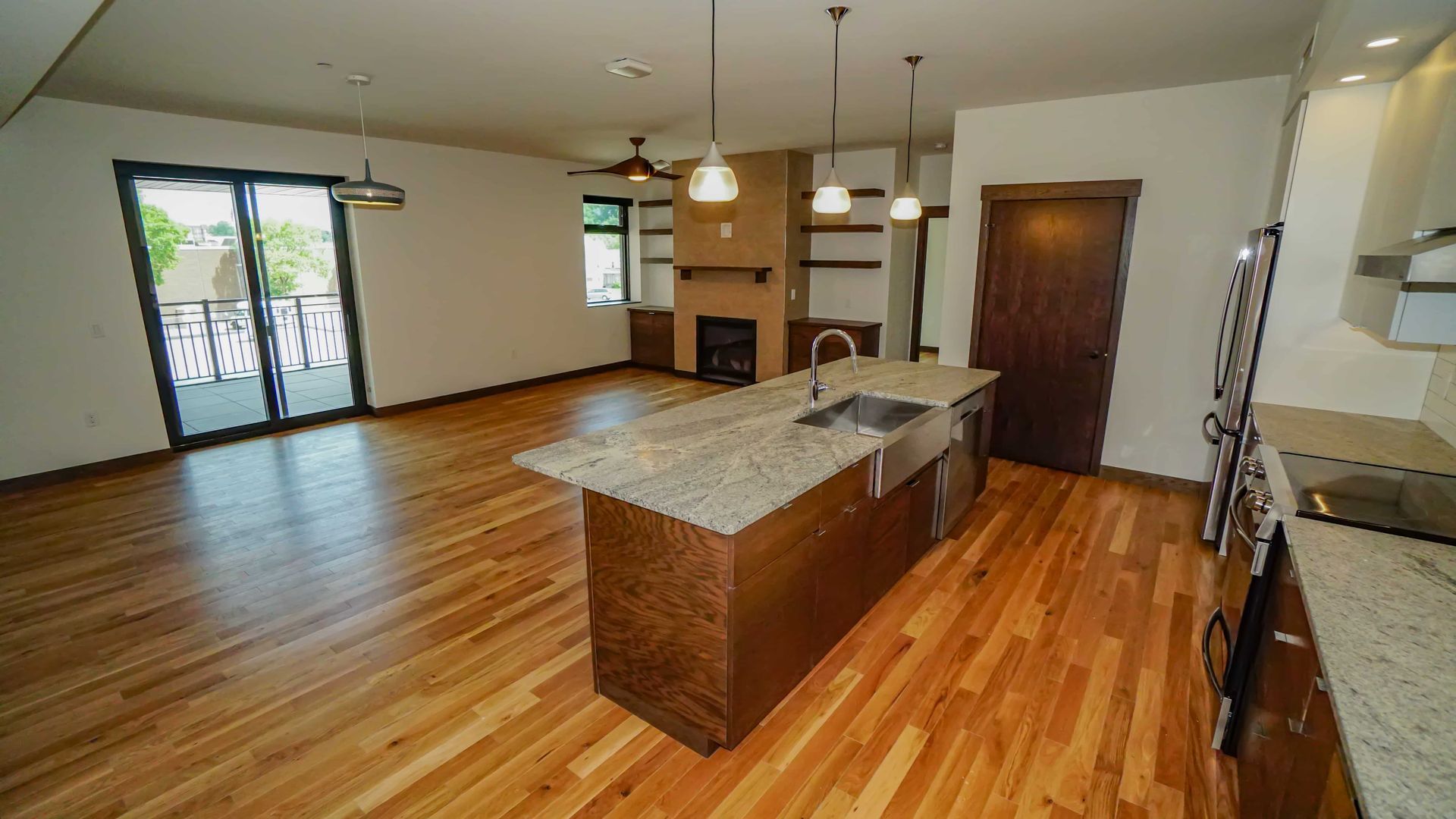 A kitchen with a large island in the middle of the room.